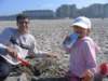dadandallyattheseasidebeachdadwastryingtodigdeepholesbutallykeptfillingthemin_small.jpg