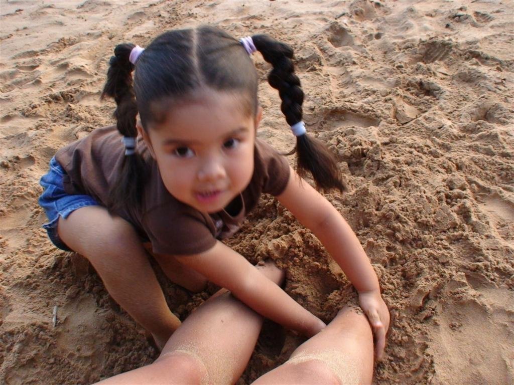 allyburiesmomsfeetinthesand.jpg